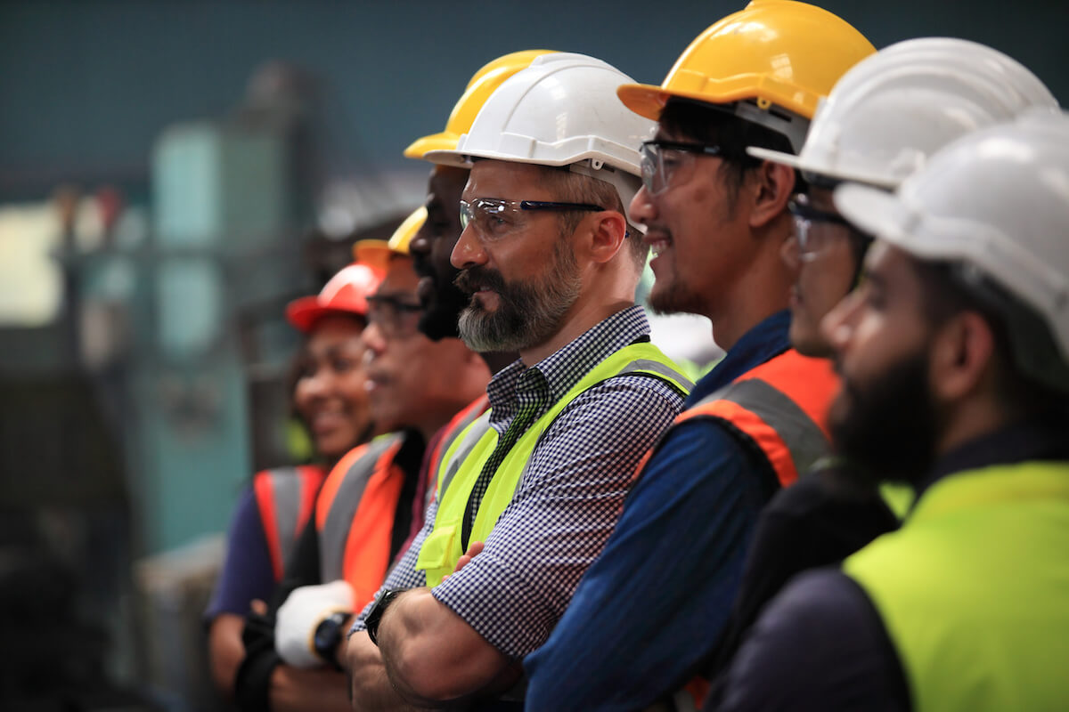 Group of construction workers listening to presentation