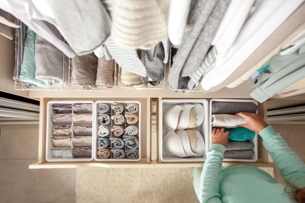 WeServe Woman Put Her Clothes In An Organized Containers To Reduce Clutter