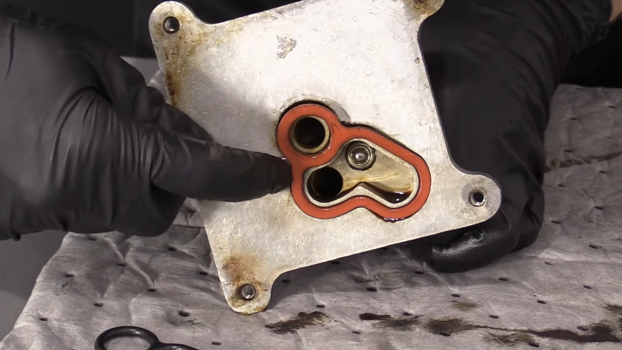 Pry old oil cooler gasket off