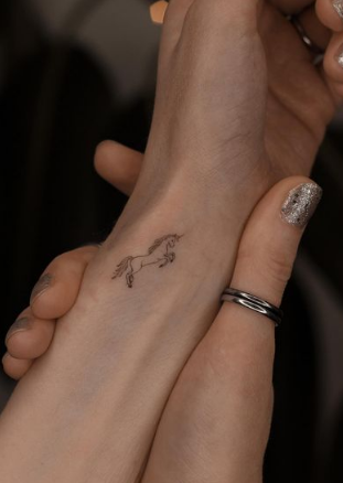 Cute And Simple Unicorn Tattoo Design For Women