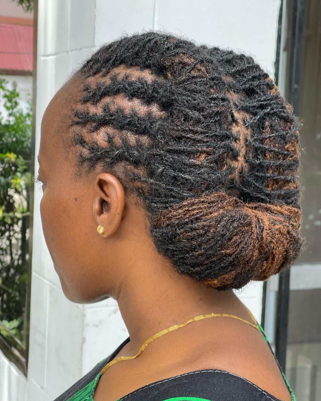 38. Intertwined Locs Style with Low Pony