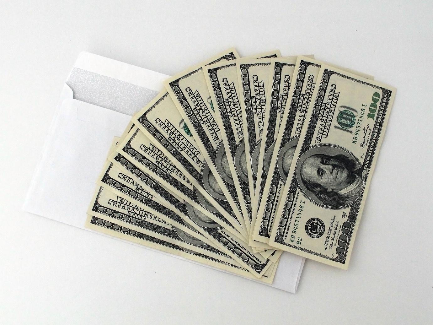 A stack of paper money

Description automatically generated with medium confidence
