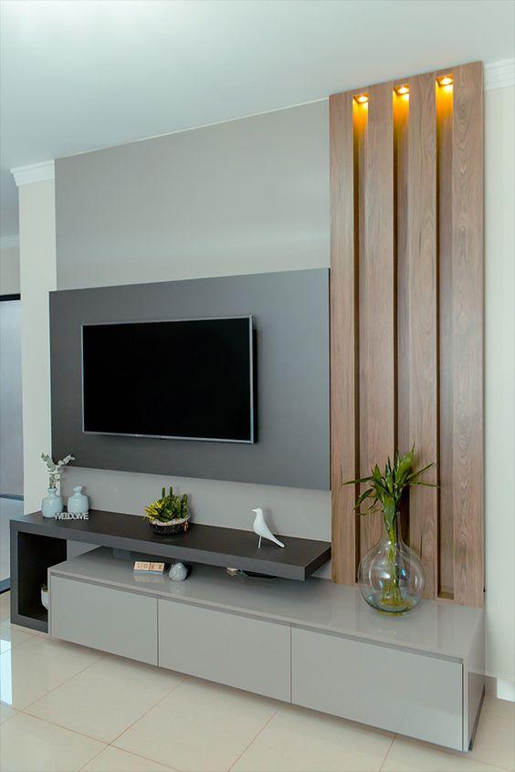 Painel de TV em MDF cinza harmonizando com rack em tom de cinza mais claro.