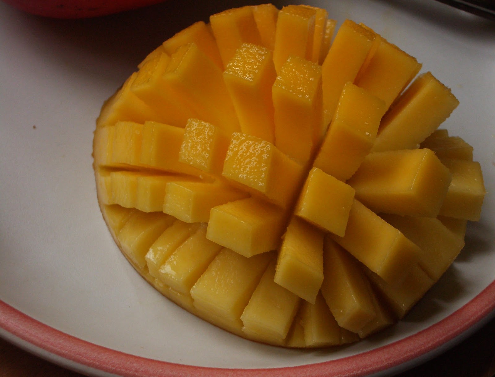 A halved, inside-out mango is
