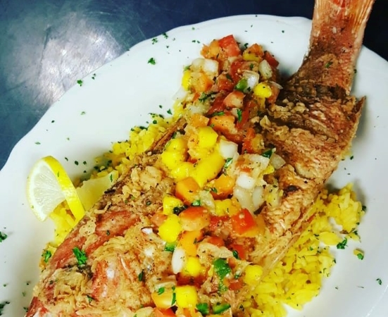 Whole fried snapper with mango salsa from the Stein & Vine restaurant in Brandon, FL.