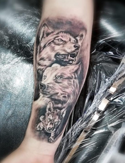 Attractive Wolf Family Tattoo Design On Forearm