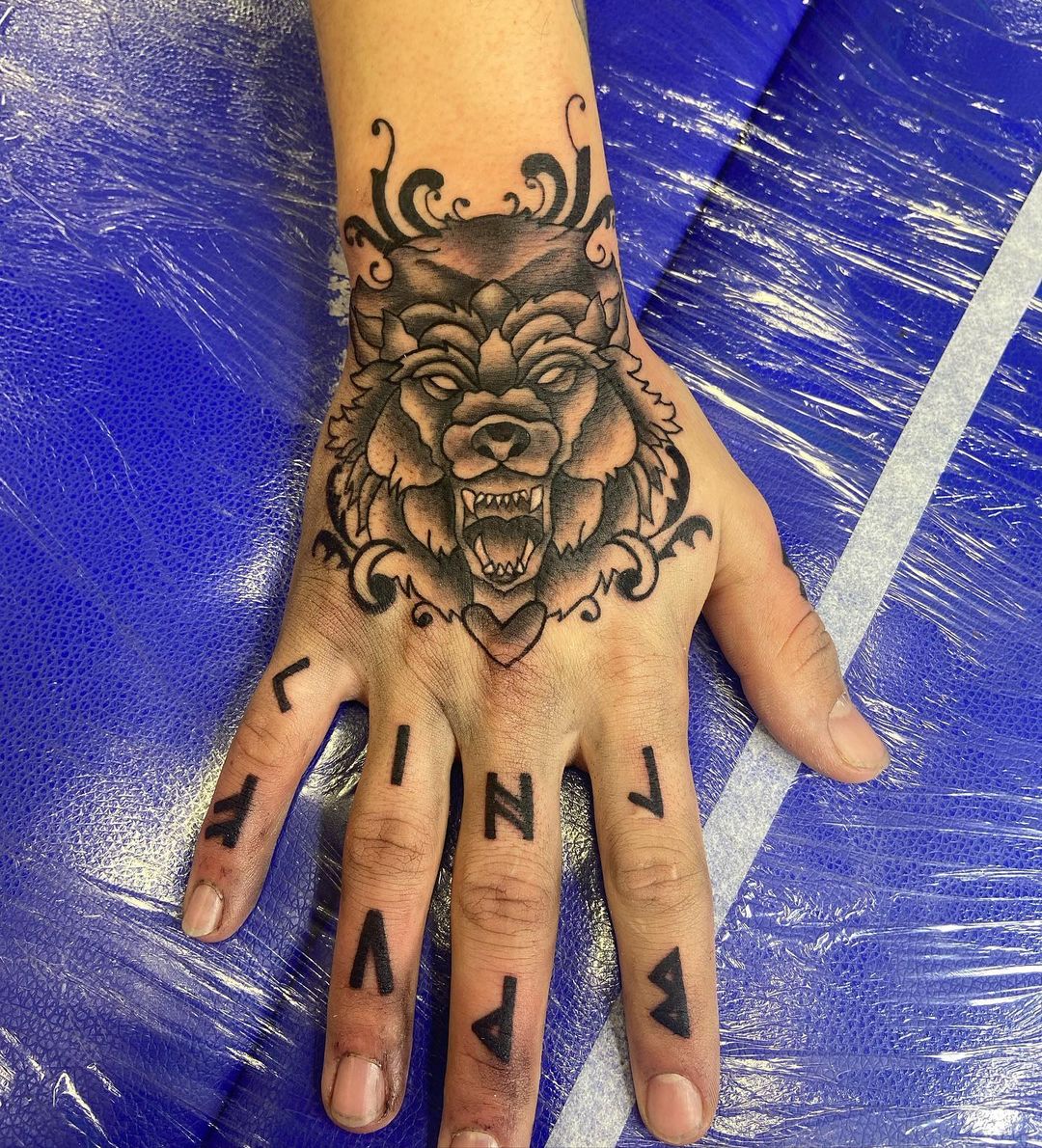 Wording And Wolf Tattoo