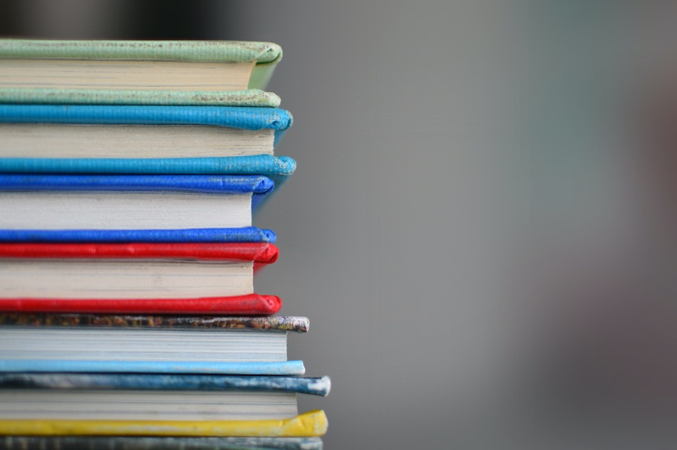 A stack of multi-colored books