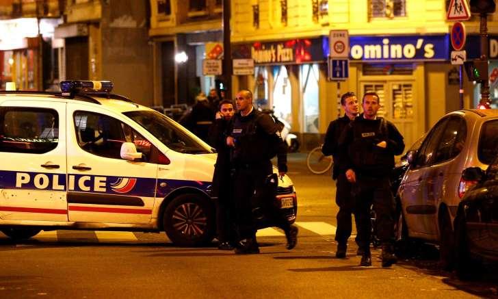 Paris shooting: Police officers arrive at the scene of a shooting in Paris on Friday night.