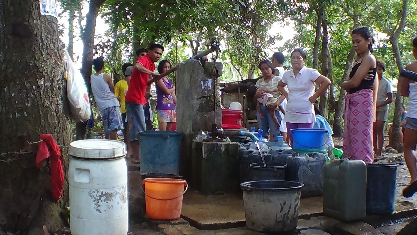 022916 Filling Buckets at the Well.JPG