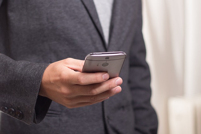 man checking smart phone