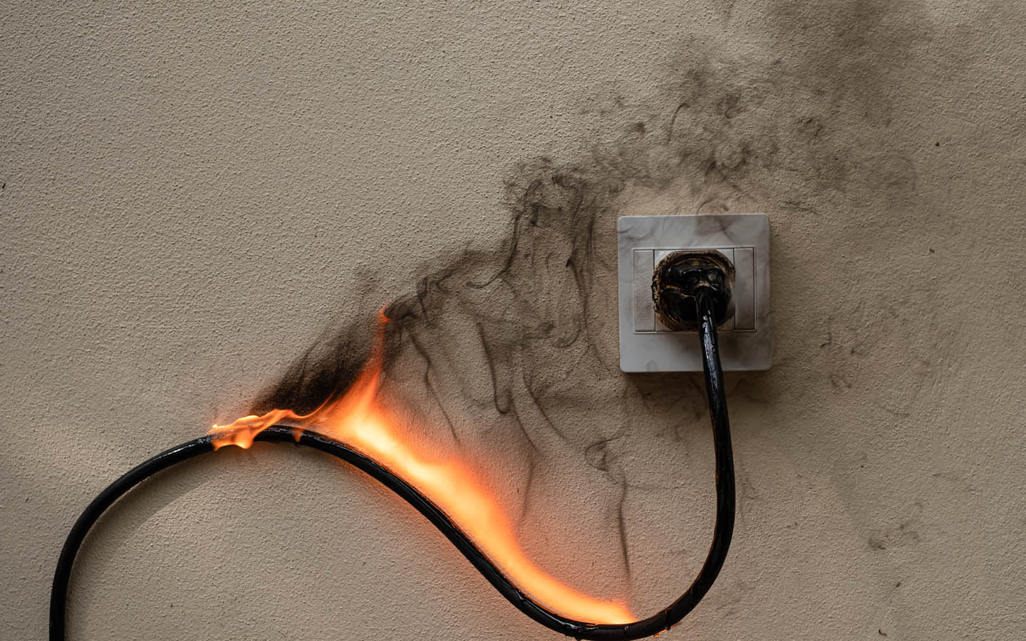 signs of electrical problems in home: burnt outlet