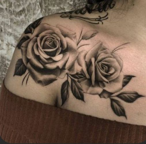 lady wearing 2 roses tattoo on her shoulder