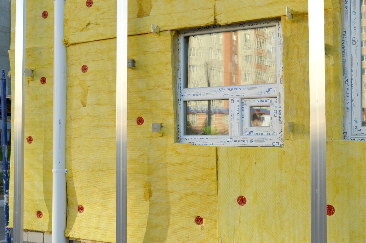 A home under construction with wall insulation and tape