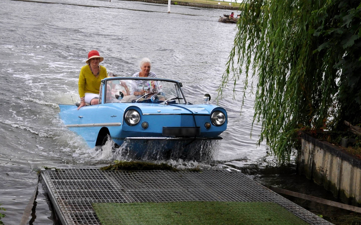 old women in amphibious car