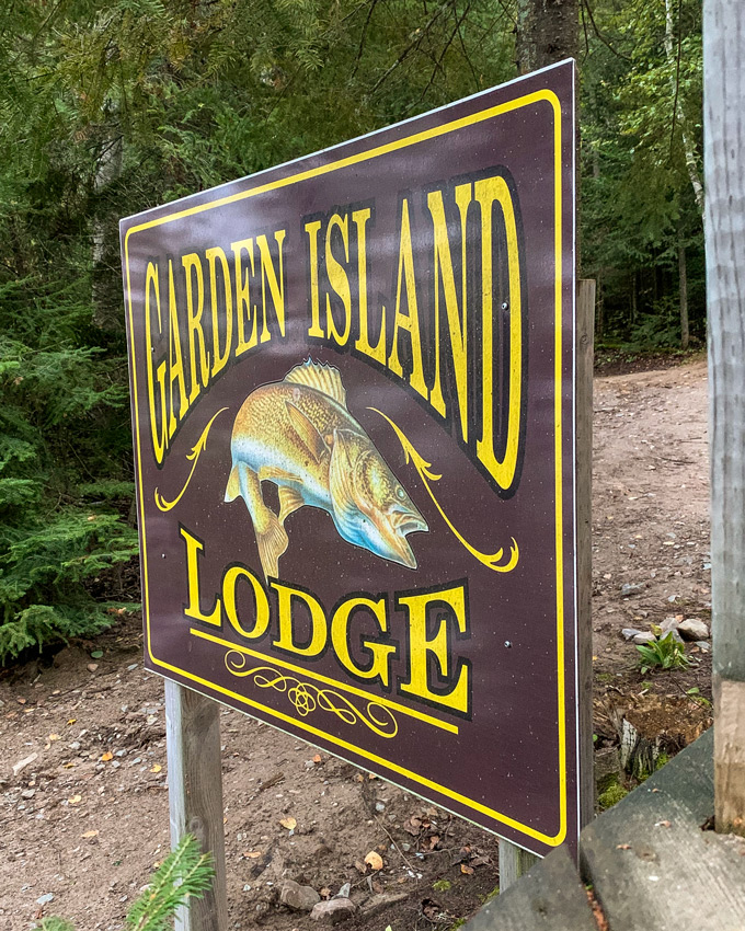 A sign reading Garden Island Lodge