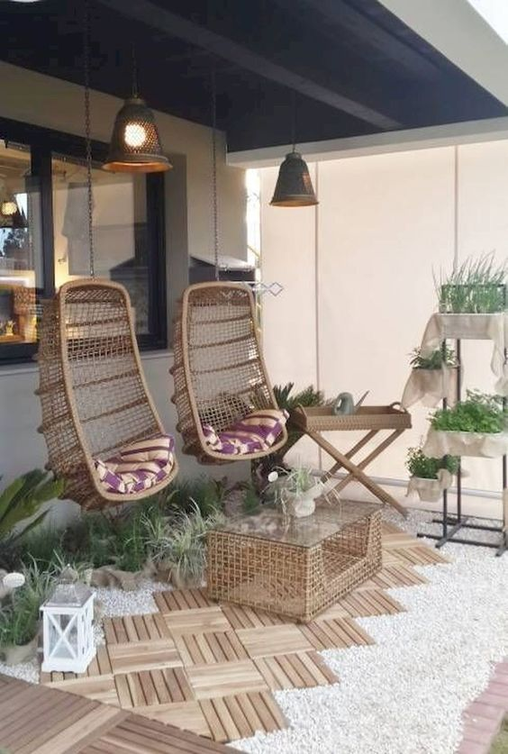 a balcony with swings and plants