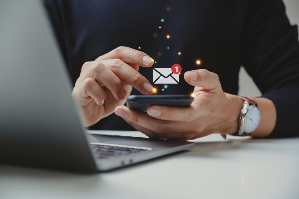 man-using-cellphone-reading-email