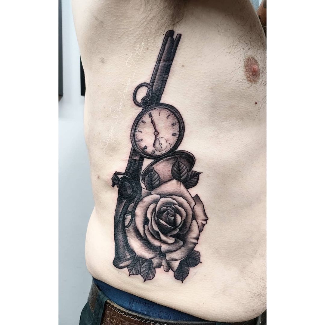 Gun and Clock Waist Tattoo