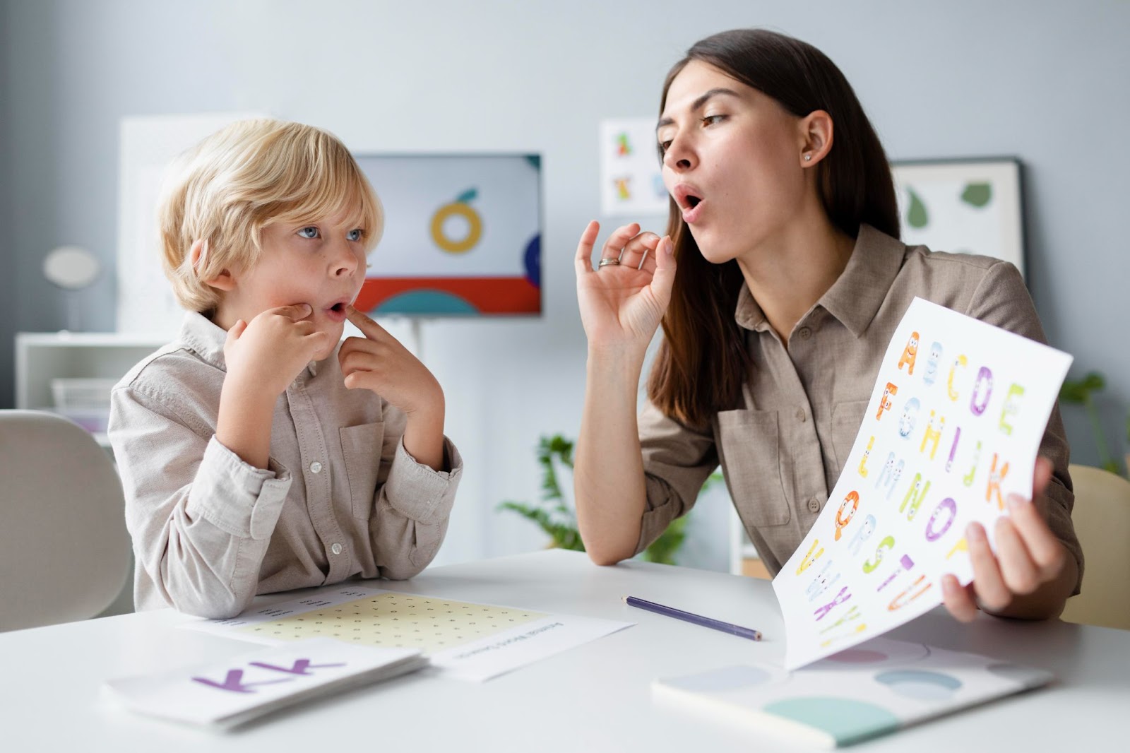 Pronunciation skills is being learned by a kid