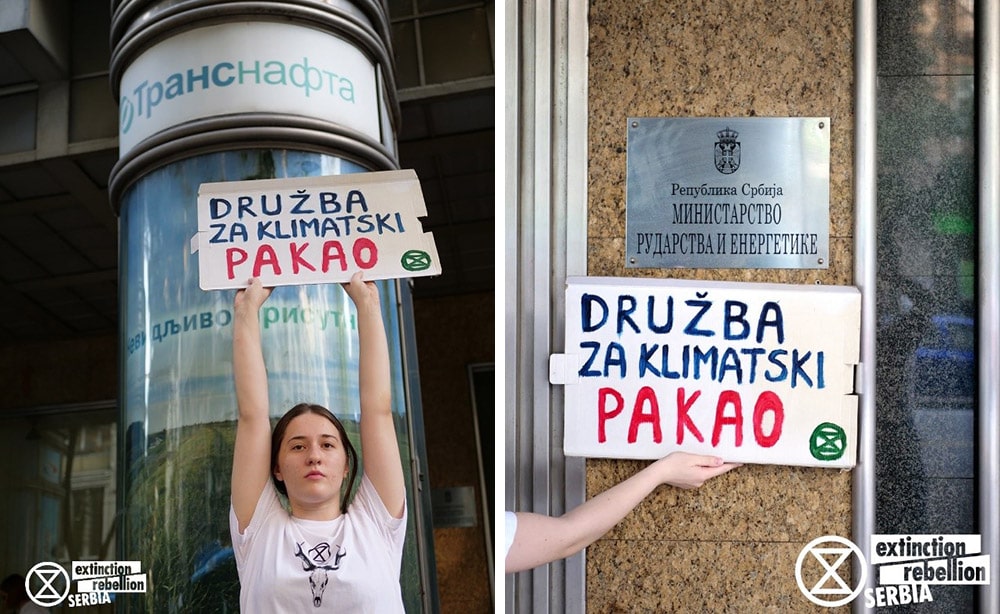 A young rebel woman holds up a sign outside the Serbian ministry