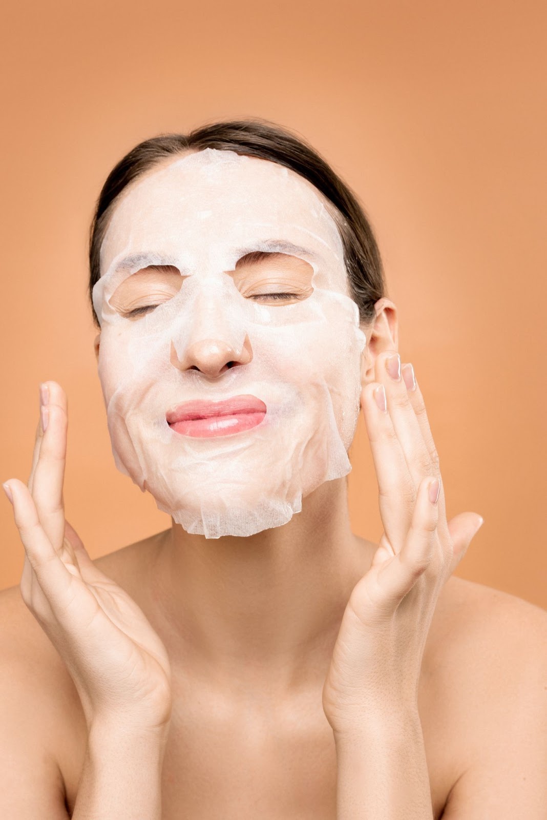 A woman with a facial mask for skincare 