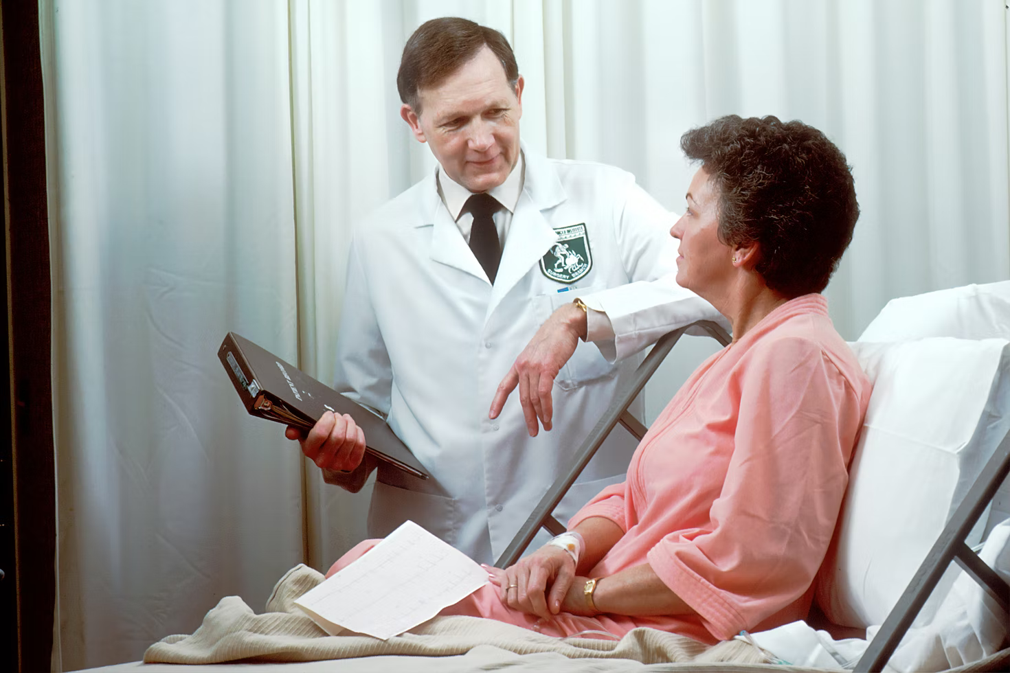 A hospitalist talking to his patient