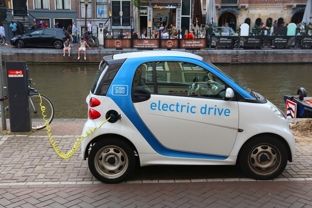 electric-car-from-Dutch-shared-mobility-company-charging-on-the-side-of-a-canal