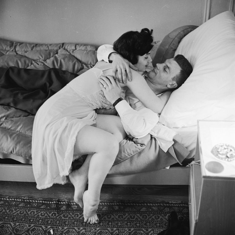 1950 A woman bends over to kiss a man