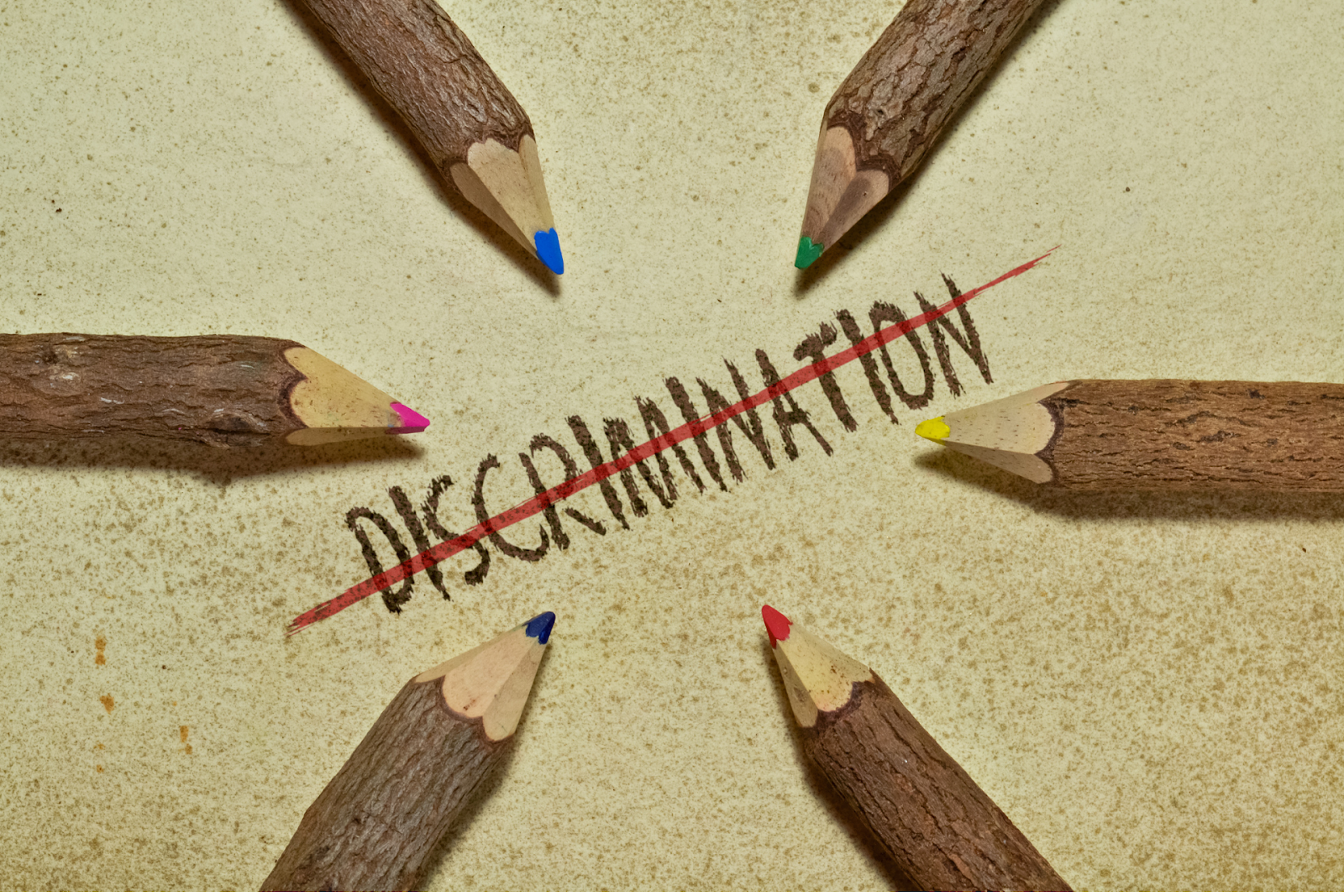The word “discrimination” struck out by a red line
