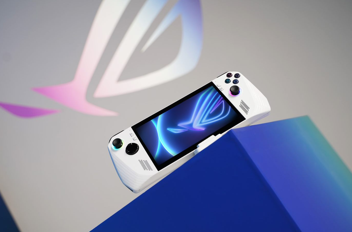 A white gaming device with a screen on it

Description automatically generated