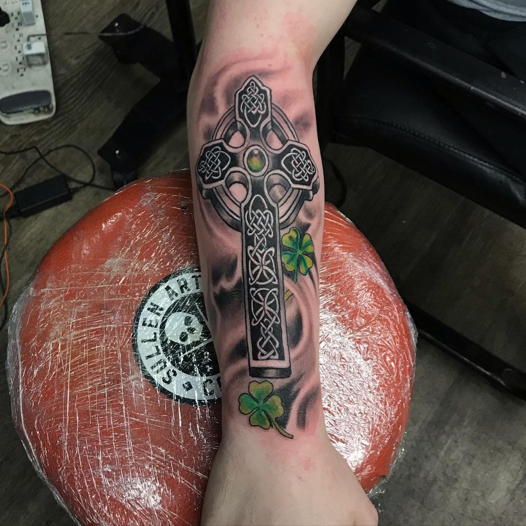 Celtic Cross with Green Leaves Tattoo Design