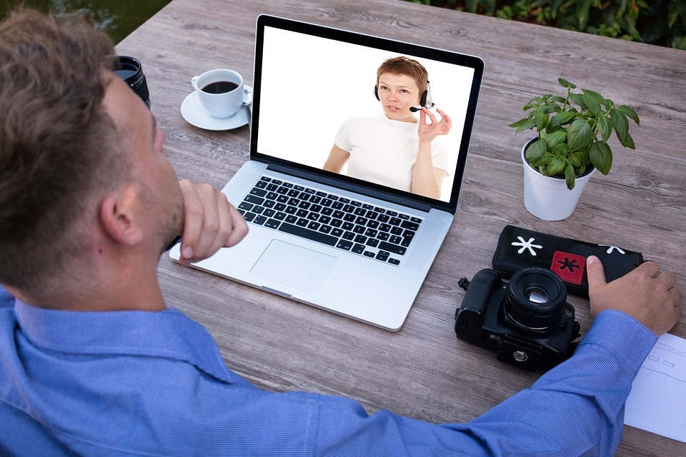 A man video chatting with a woman