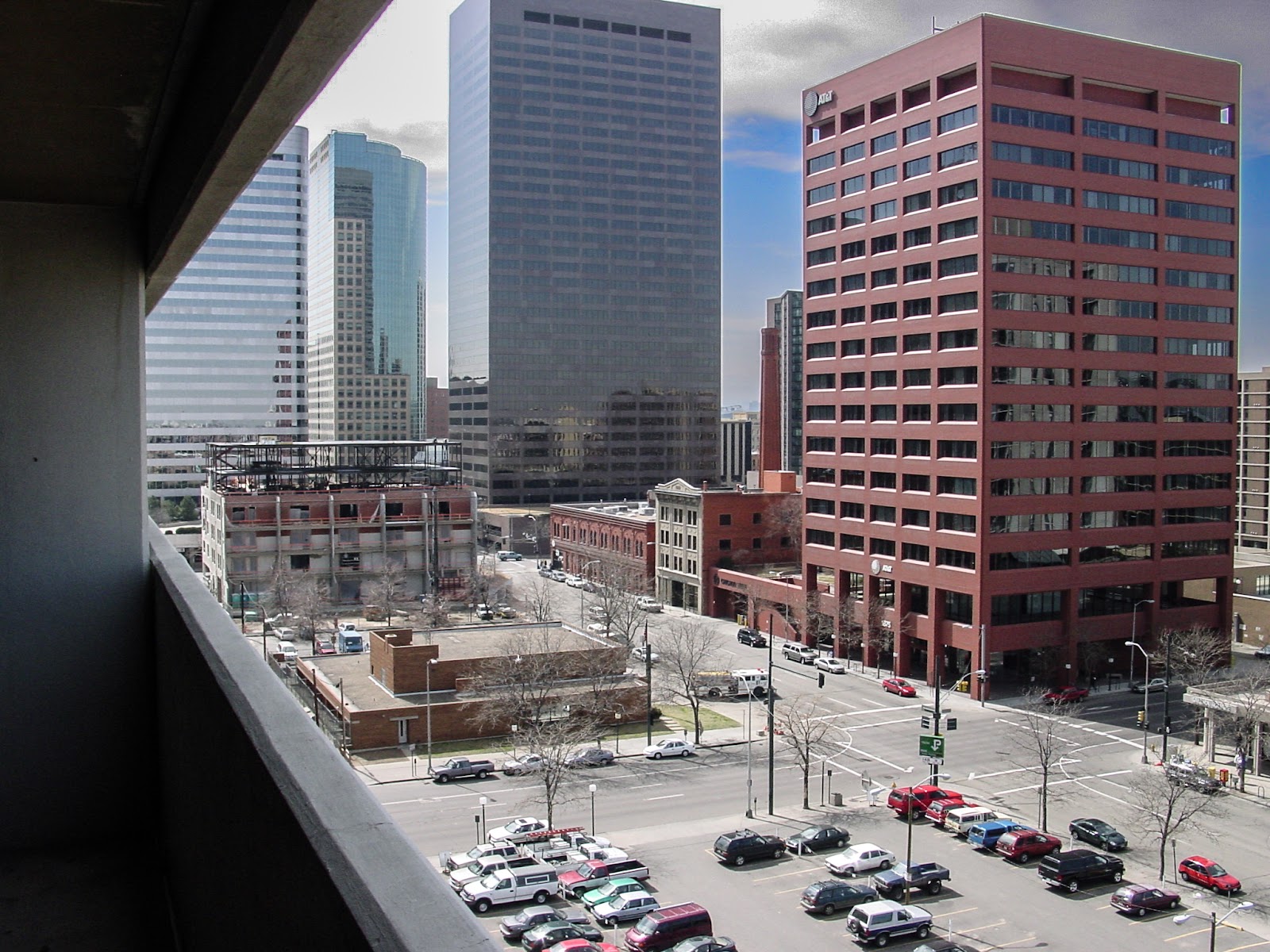 View of downtown with tall buildings and a parking lot.