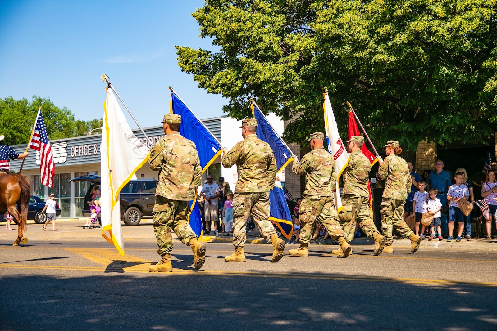a group of soldiers marching with flags