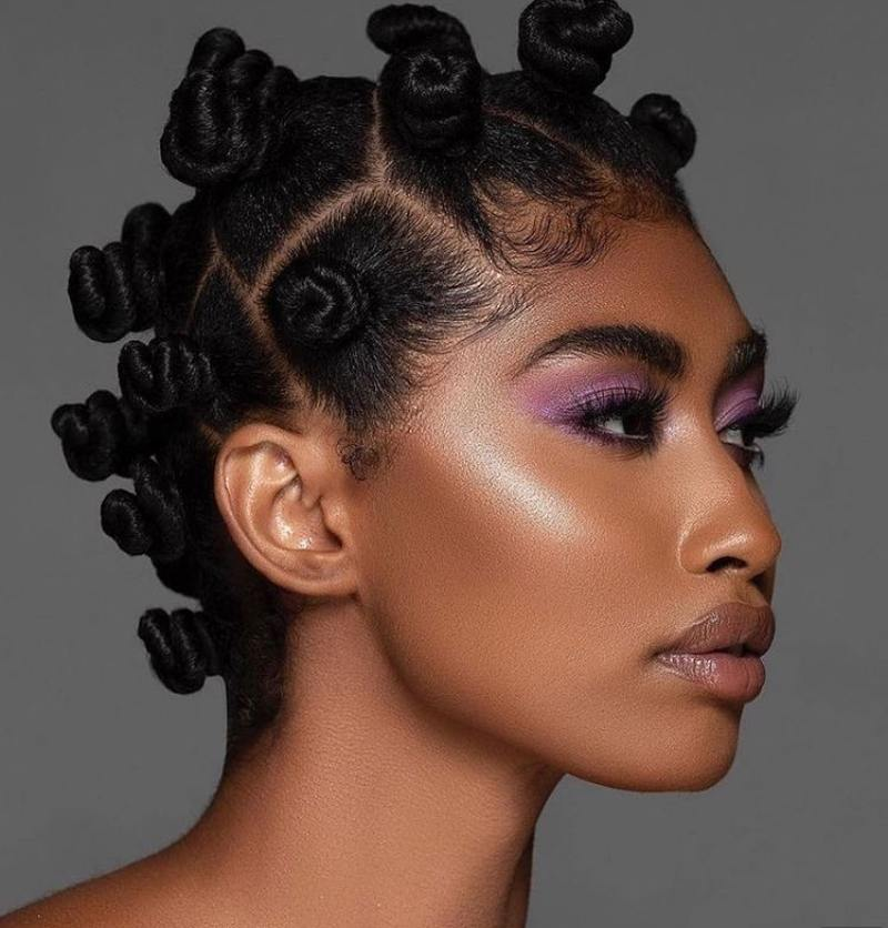 Black model wearing bantu knots