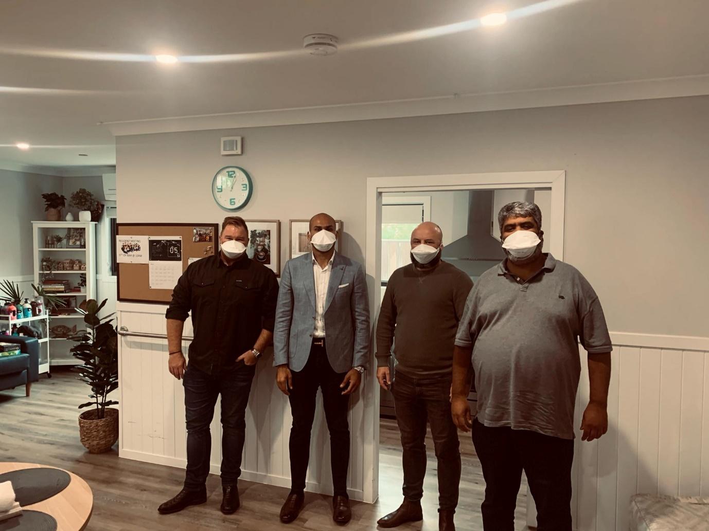 A group of men wearing masks  Description automatically generated with medium confidence