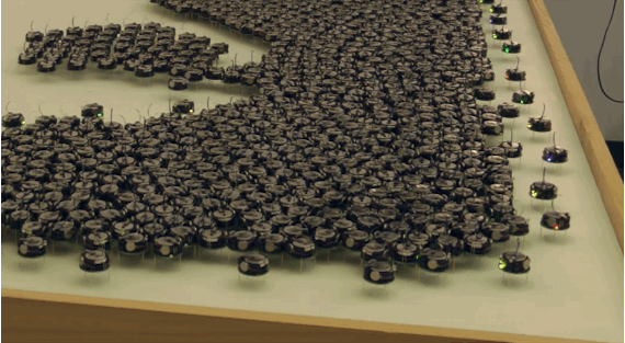 A swarm of tiny robots moving together as a unit.