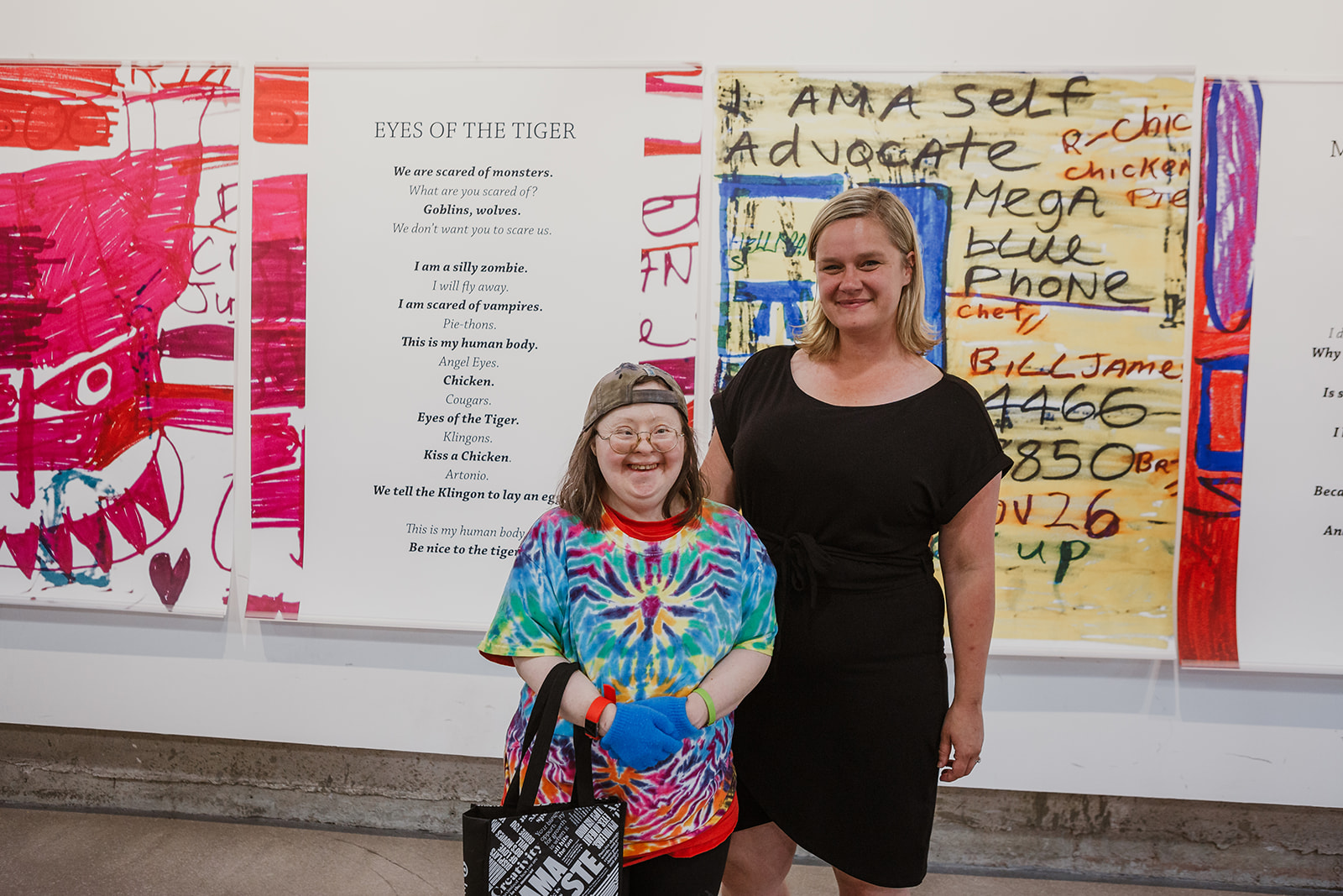 Artist Teresa Pocock and Rebecca Pauls, Director of PLAN stand in front of Teresa's artwork at 312 Main Street, Vancouver. July 22, 2019. Photo by Isabella Sarmiento, This Is It Studios.