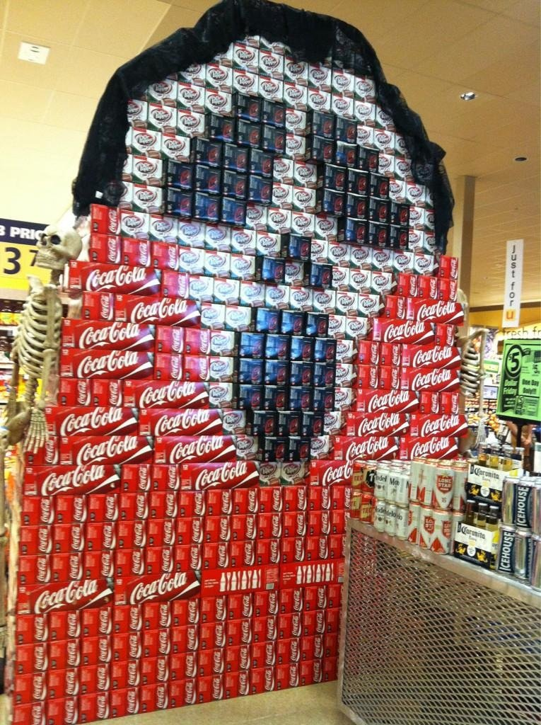 Soda boxes organized to mimic the Scream mask