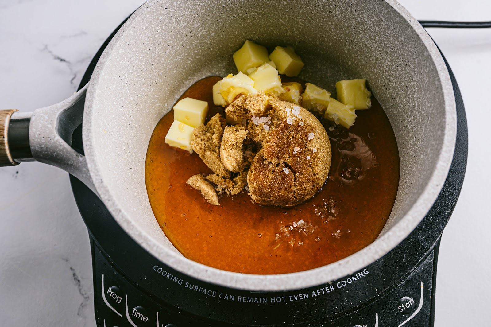 Heat your honey, butter, brown sugar, vanilla, and sea salt in a saucepan over medium heat. 
