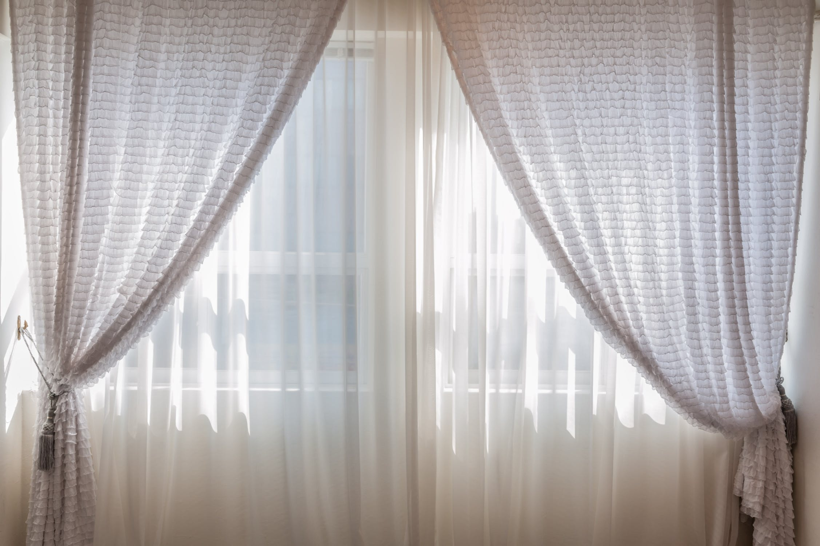 Sheer curtains layered for light filtering; window treatments; MGSD interior decorating