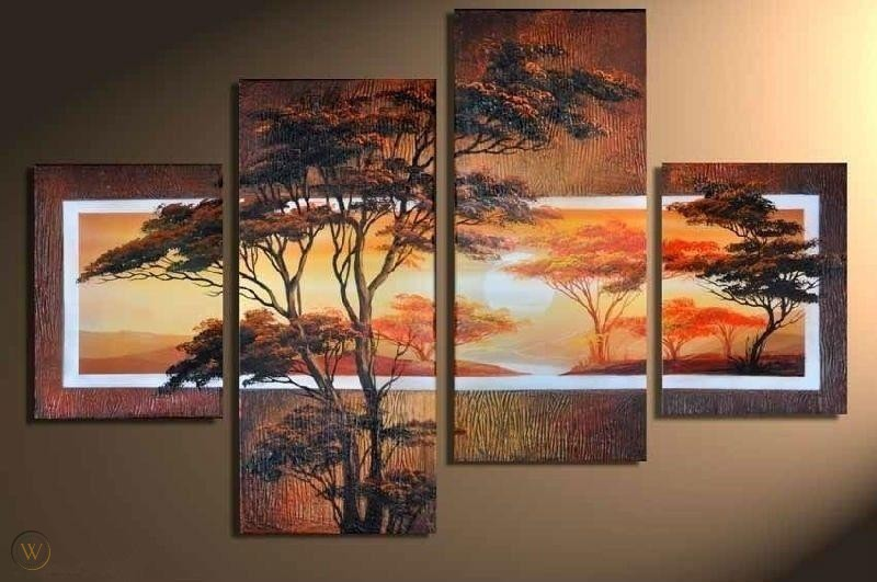 Landscape of sunset with trees split into 4 rectangular frames displayed on a wall.