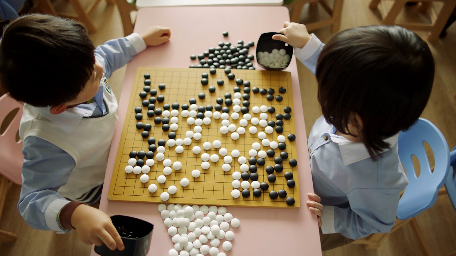 Two children playing Go - Movie Still