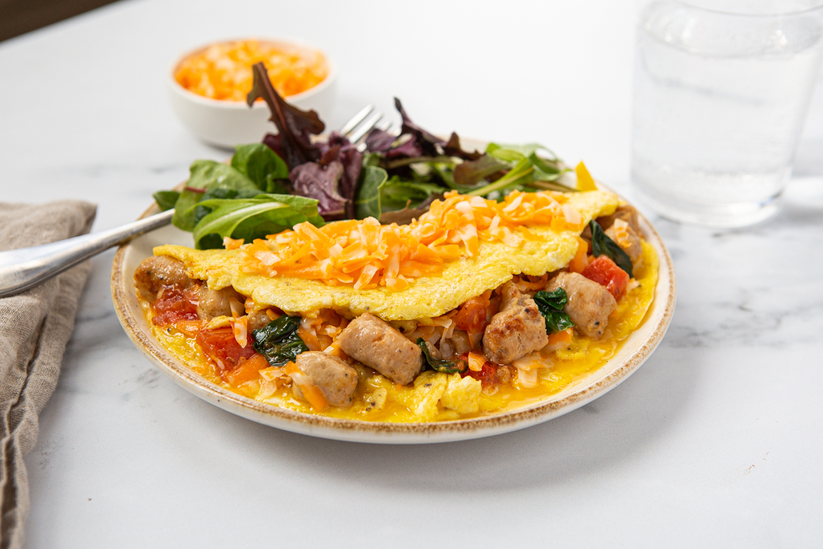 sausage and cheese omelette served on  a plate