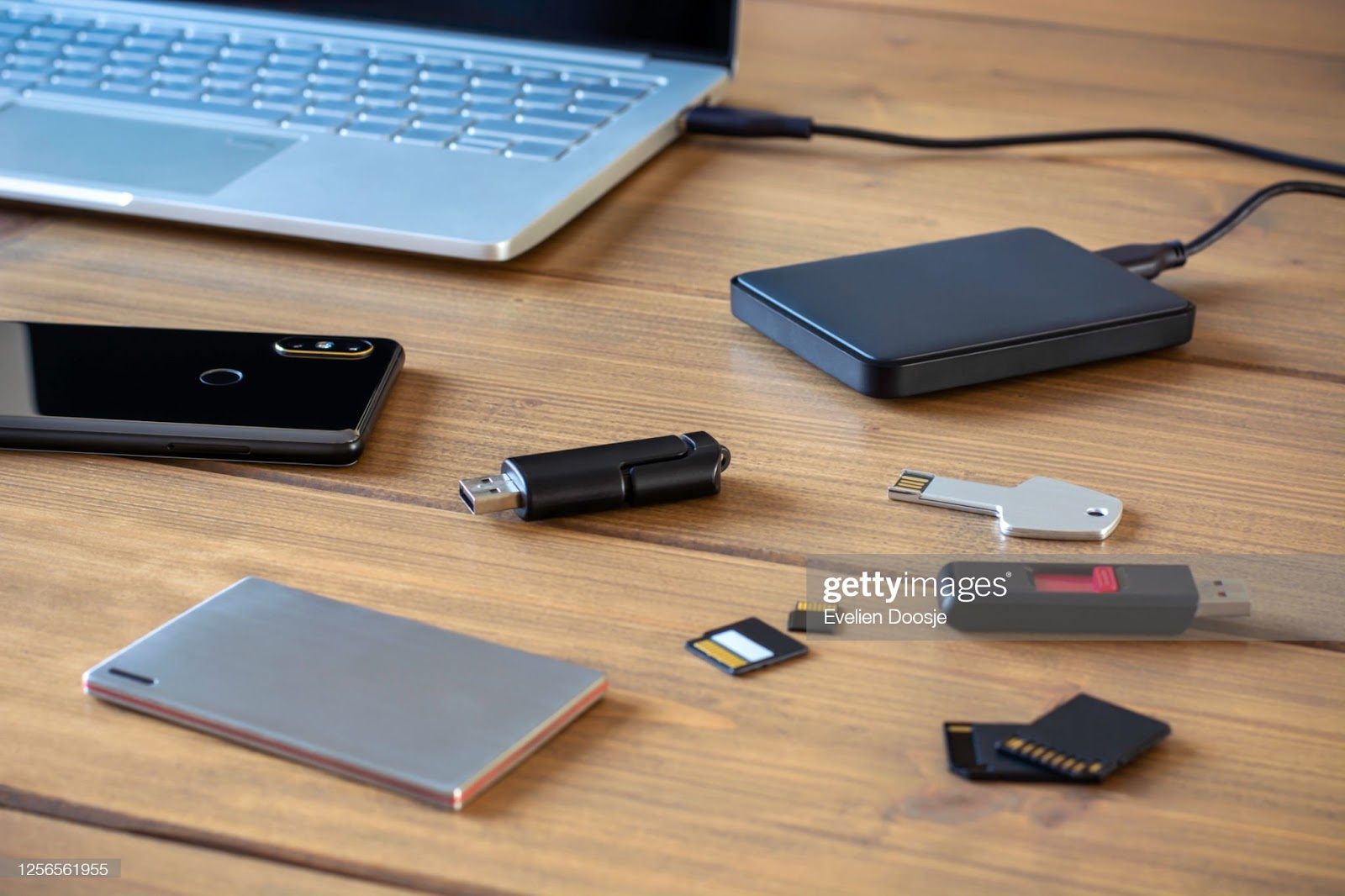 Various digital data storage devices. Usb sticks, external hard drive, SD cards, mini and micro SD cards, laptop and smartphone : Stock Photo