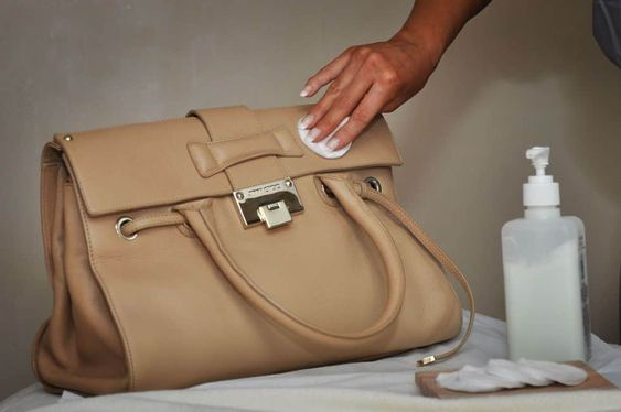 a picture showing how to clean leather bags with a cleaner