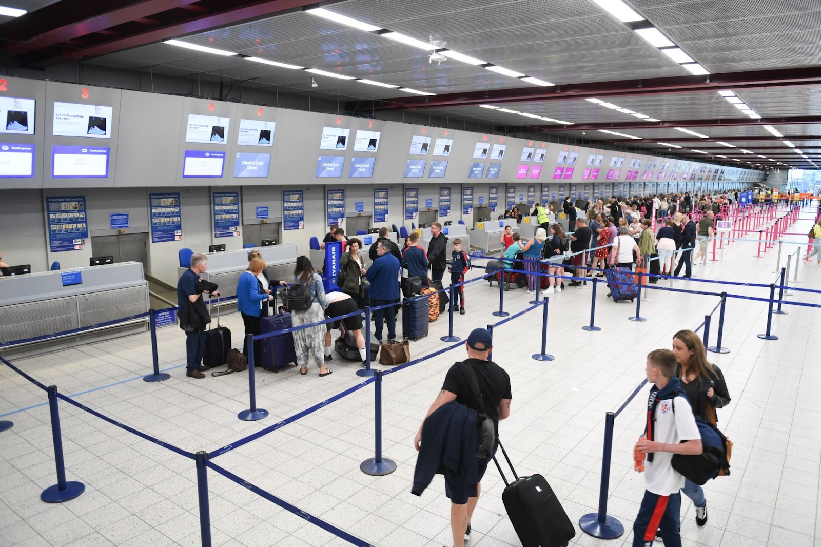 people queueing at the airport