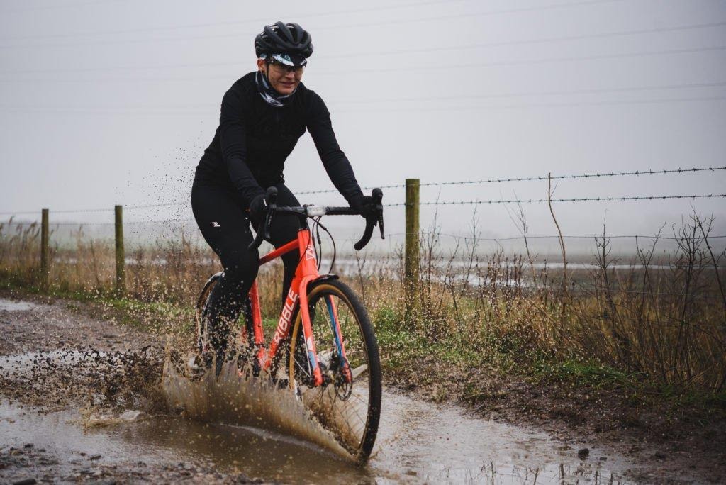 Mudgurdas are needed on a mountain bike to protect the rider from splashing water and mud.  