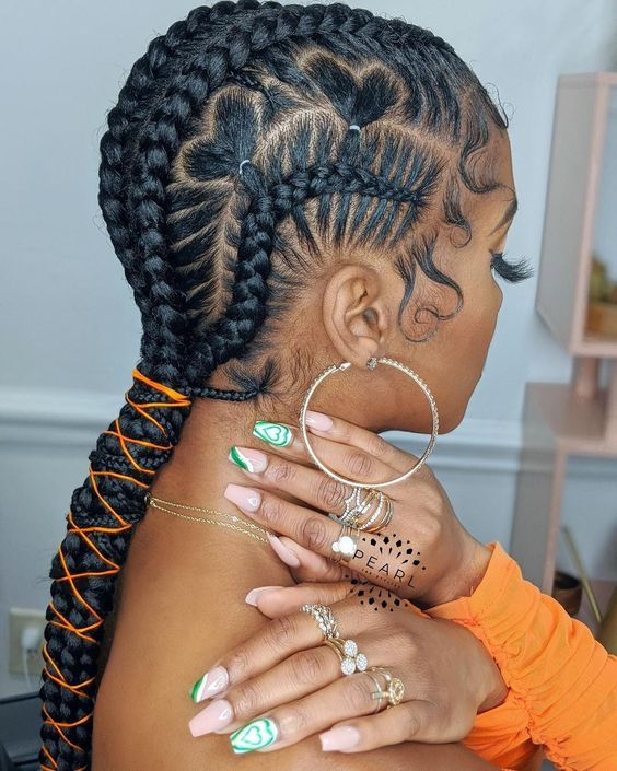 lady wearing feed-in braids with love designs